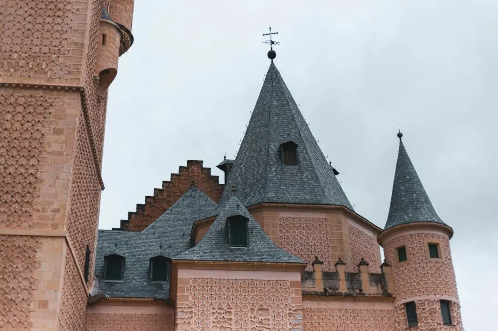 A very tall brick castle with a clock on it's side, illustrating planning a visit